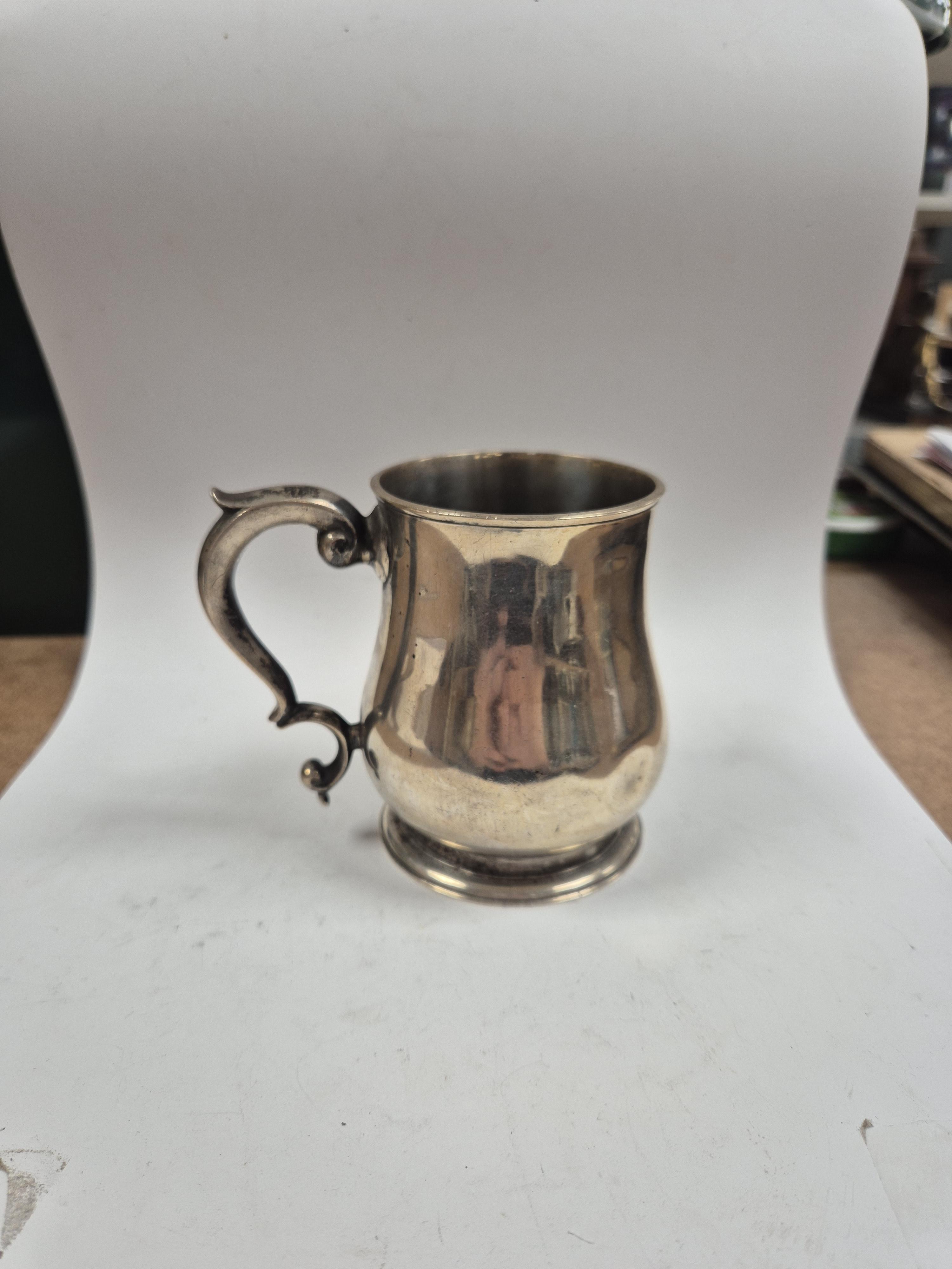 A George V silver baluster mug, Goldsmiths & Silversmiths Co Ltd, London, 1917, height 92mm, 8.8oz. Condition - poor to fair